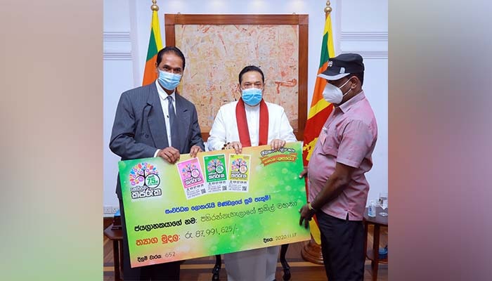 Hon. Prime Minister awards cheques to two super winners of Development Lotteries Board